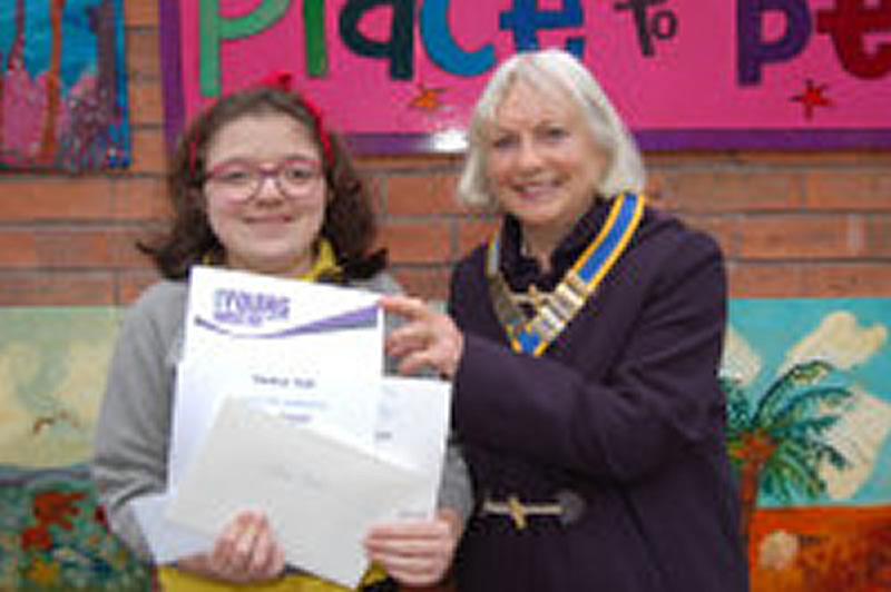 Rosie Painter from Ark Little Ridge Academy with last year's president on presentation of her award as local winner and runner up for  District prize taken by Isla Sidwell in the Y W Competition.